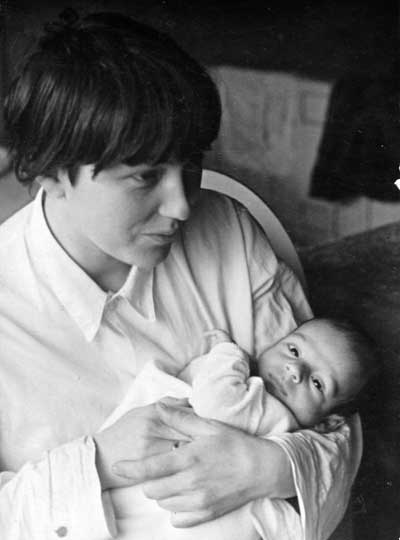 Ruth Abbo (Schulz) holding a baby